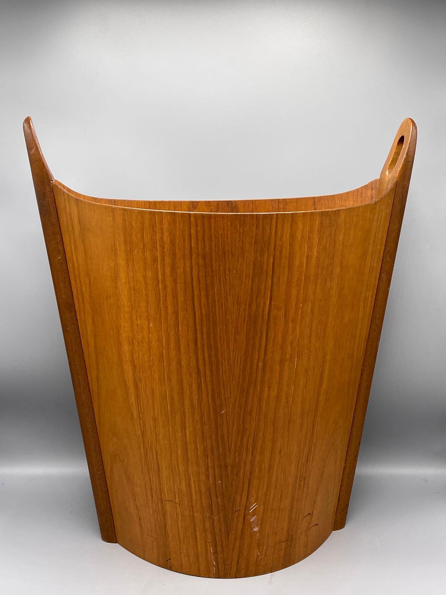E. Barnes P.S. Heggen Waste Bin: A Danish teak waste bin by Einar Barnes for P.S. Heggen with cylindrical form and handles. 17-1/2 in tall.