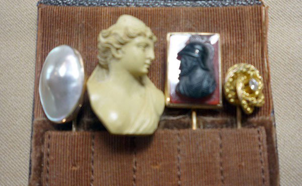 Lot of Four Stick Pins: Lot of four early stick pins. 1) 10K yg with abalone. 2) 14K yg with banded agate cameo. 3) Carved lava relief female bust. 4) 10K yg with Victorian knot, centered with a small old mine cut diamond. 7