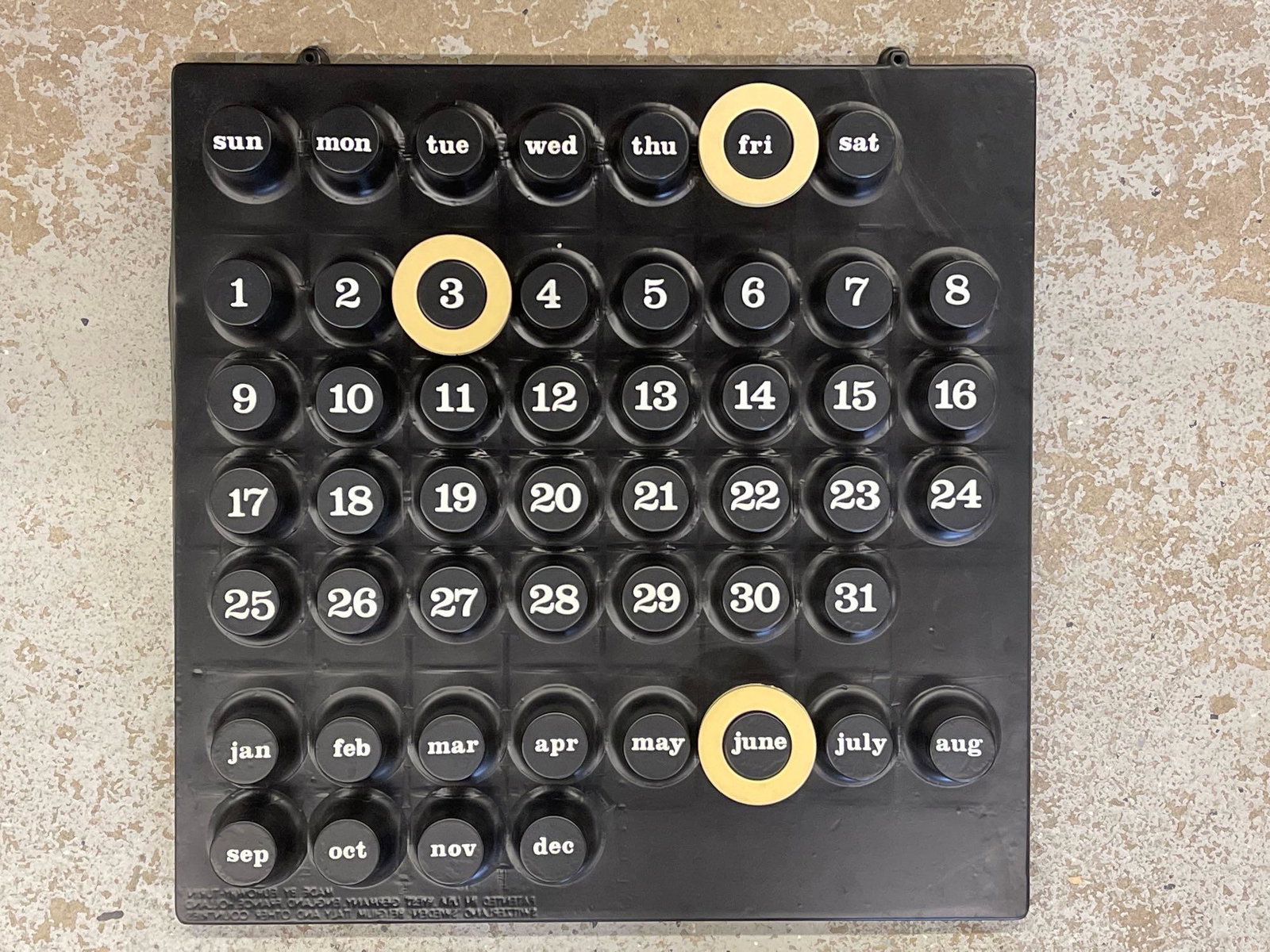 Euroway Ring-A-Date Calendar: A Euroway "Ring-A-Date" pop art-style molded plastic calendar designed by Giorgio Della Beffa, made for Euroway-Turin. Black plastic with white painted numbers and letters. Made in Italy. 18-1/2in tal