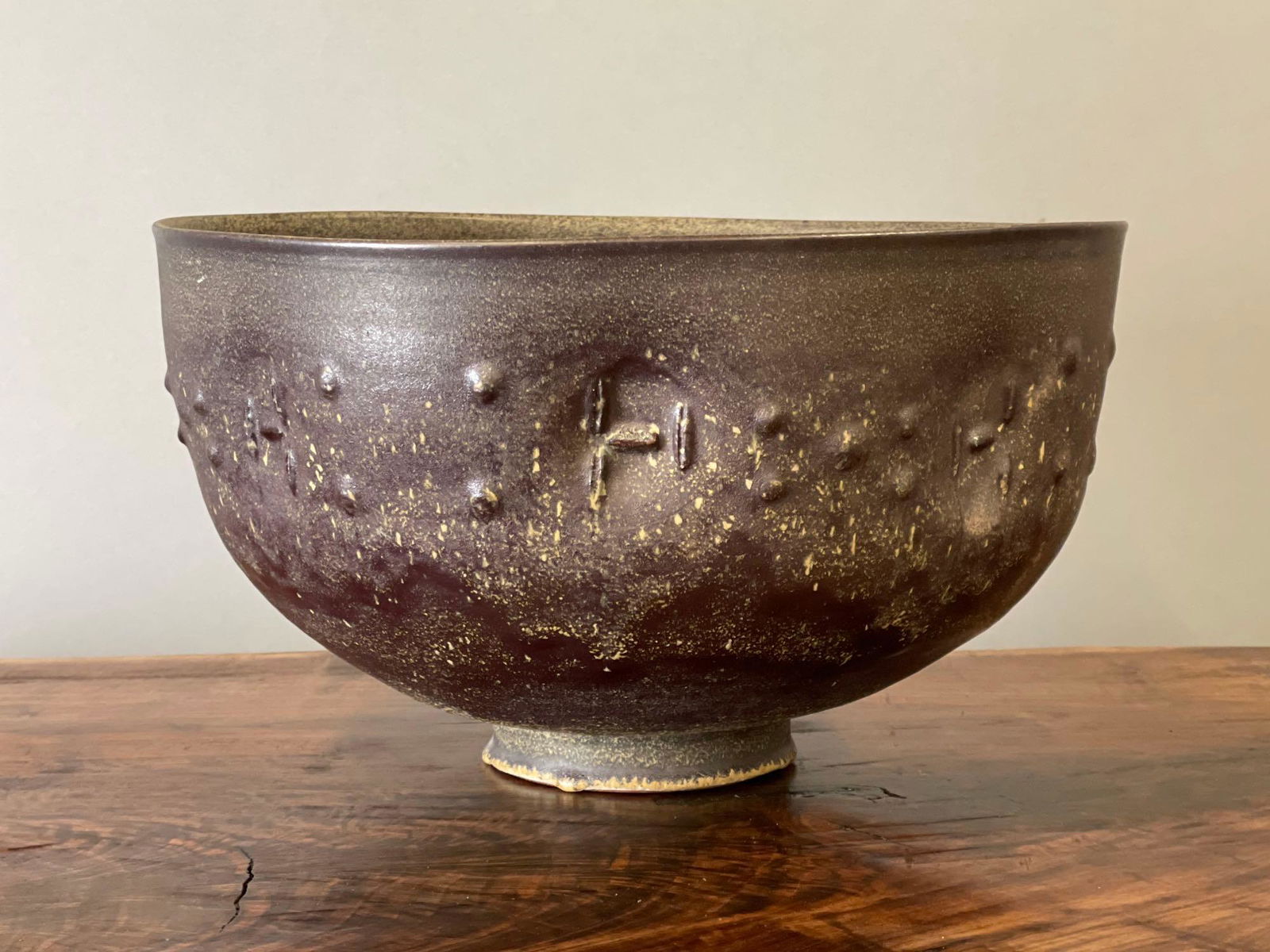 Edwin and Mary Scheier Large Vessel: An Edwin and Mary Scheier large glazed earthenware bowl with stylized face design. Untitled. Signed "Scheier" on foot. 7-1/2in tall x 13-1/2in diameter.