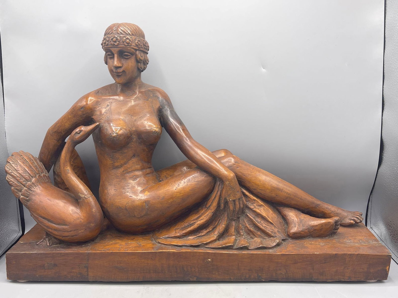 French Wood Carving of Nude: An antique French wood carving of a reclining female nude and swan. 14-1/2in tall x 21in wide.
