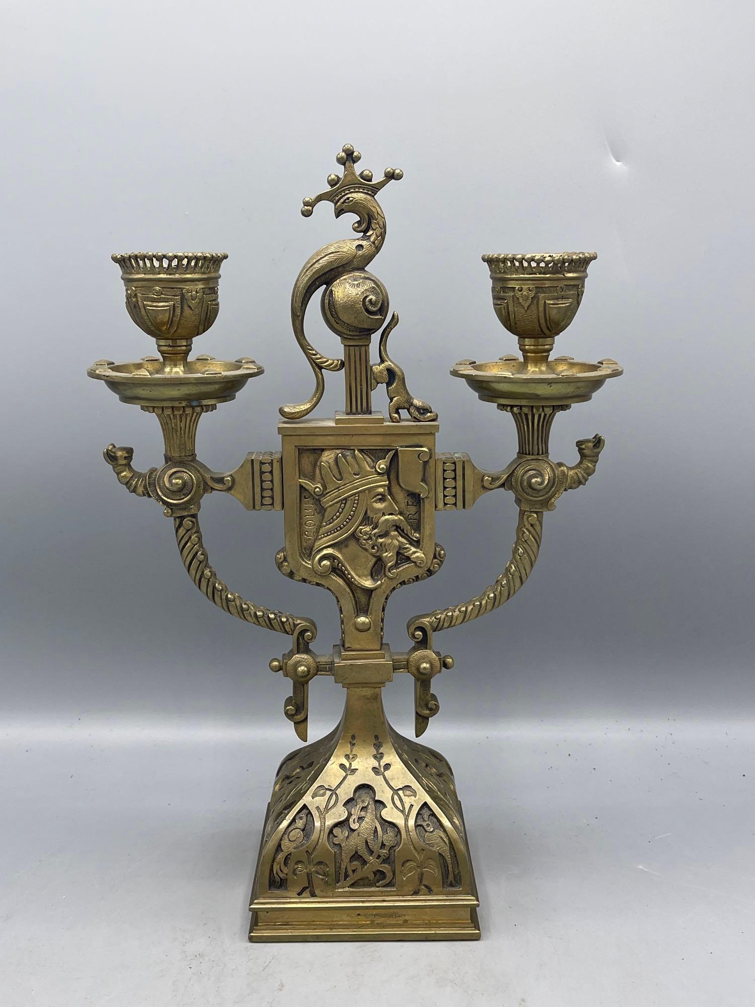 Figural Bronze Candelabra: A 19th C. figural bronze candelabra with animal detail. 12in tall x 8in wide.