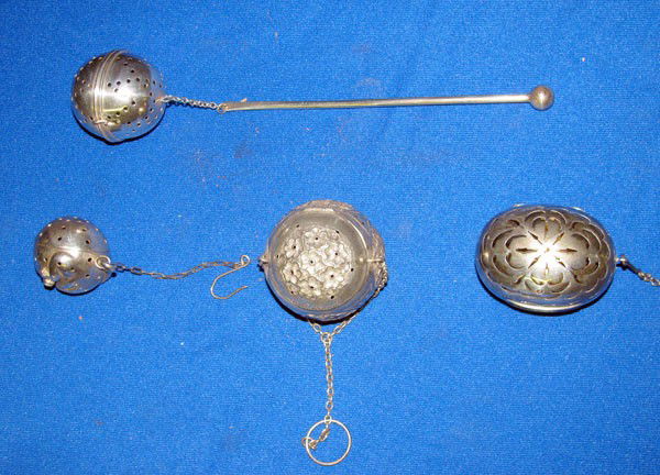 Lot of Four Tea Ball Infusers.: 4 tea ball infusers. One Newburyport Silver Co. sterling stick infuser (8-½") One Abraham Brownett & John Rose London England Sterling dated 1860 (2 ¼" x 1 ¾" x 1 ½"). One Sterling with impressed