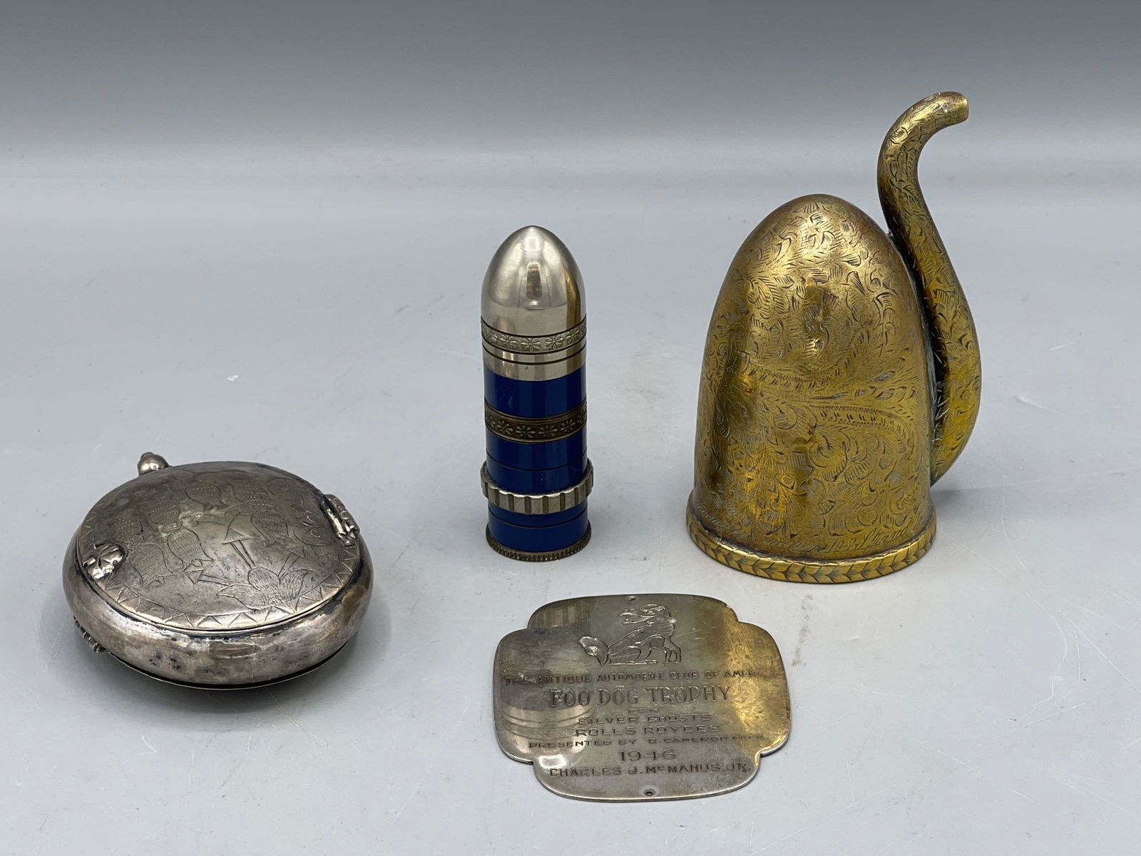 Four Antiques: Lighter, Ear Horn, Plaque, Locket (1 of 10)