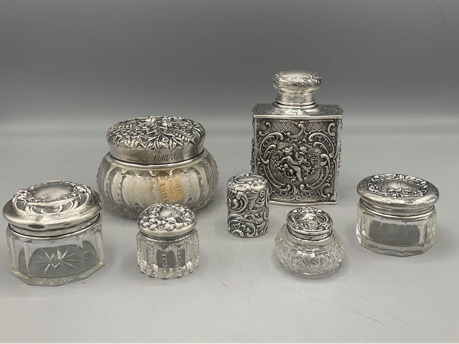 Seven Silver Repousse Dresser Accessories (1 of 9)