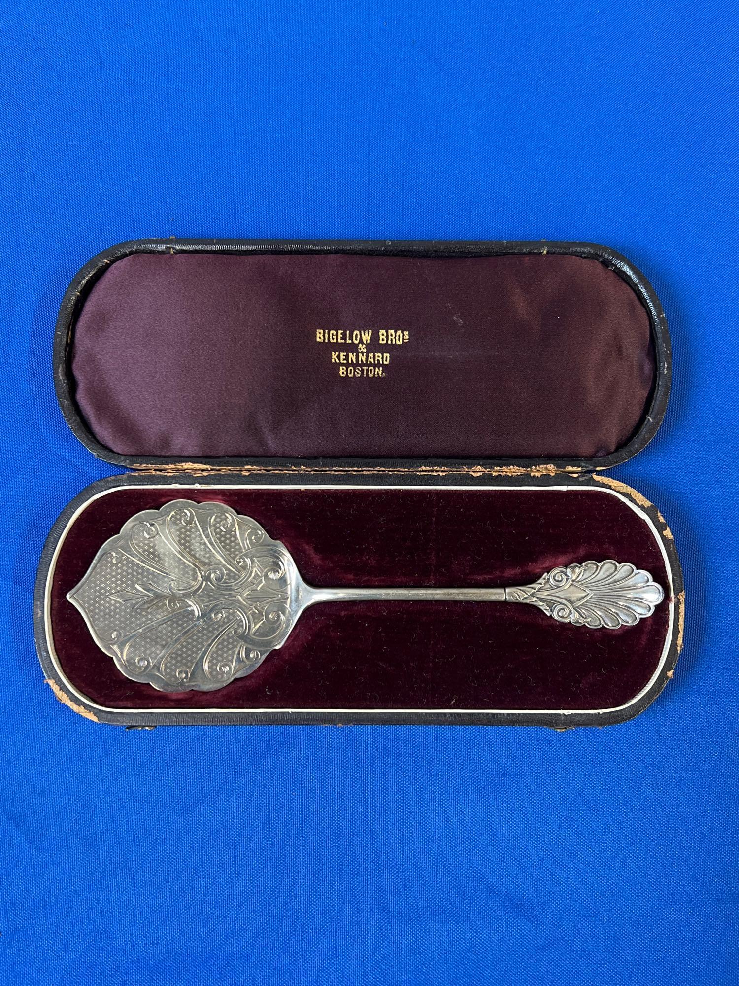 Bigelow Bros. & Kennard Coin Silver Server: A Bigelow Bros. & Kennard, Boston, coin silver server with shell handle and chased design in a fitted case. Server: 7-3/4in x 2-1/2in. Approx. 1.5 ozt.