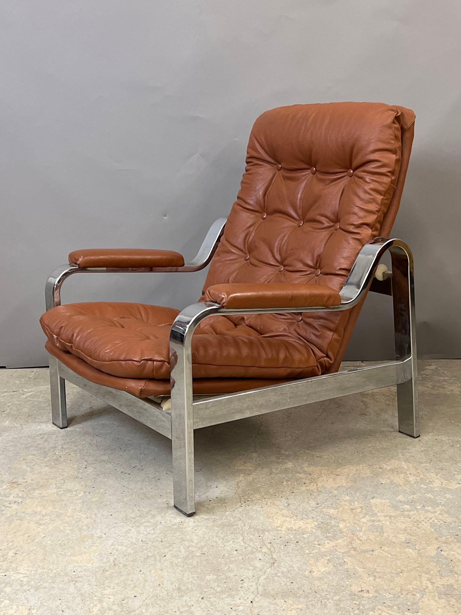 Selig Modern Design Lounge Chair: A Selig modern design reclining lounge chair with a chrome frame and tufted upholstery. 33-1/2 in tall x 29-1/2 in wide x 29 in deep.