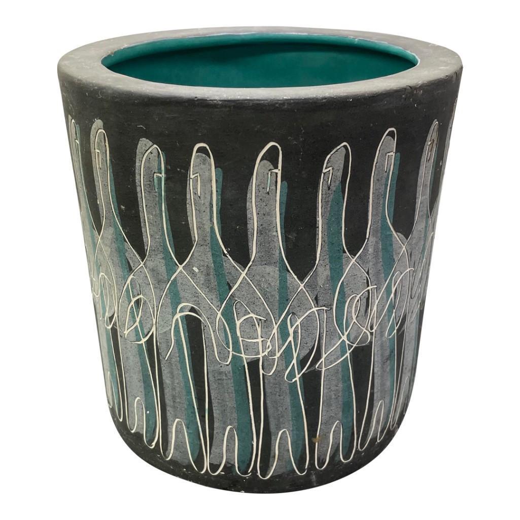 Chalice California Pottery "Mardi Gras" Planter: (B) An amazing mid-century tiki planter by artist duo Charles and Alice Smith. The piece has an incredible figural tiki design with grey matte glaze on the exterior and glossy teal glaze inside. It is
