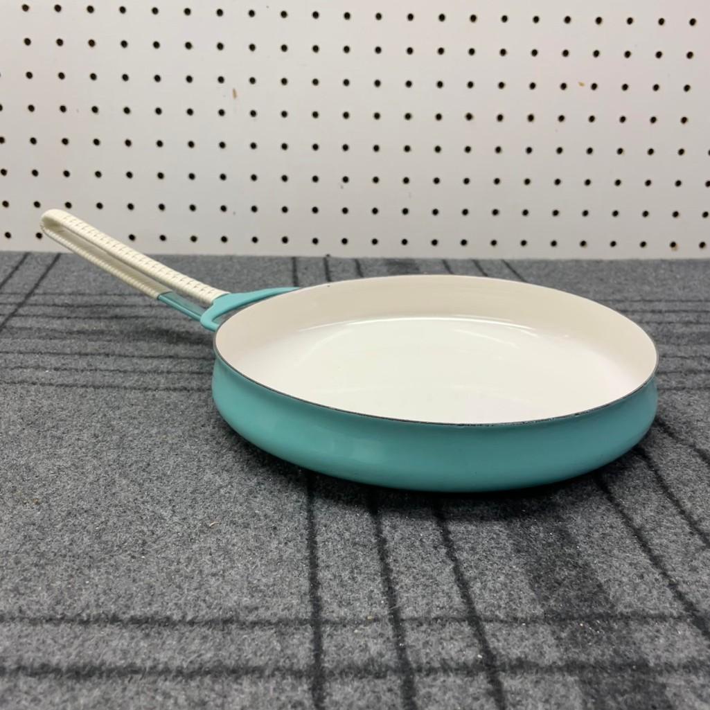 Early Dansk Kobenstyle Teal Pan by Jens Quistgaard: (B) An early Dansk Kobenstyle Denmark skillet by Jens Quistgaard. It has the original white woven accents around the handle. It is in excellent condition. Measures 3.5inW x 13.5inD x 1.75inH. Global s