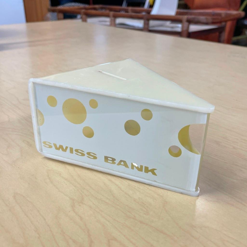 Vintage 1980s "Swiss Bank" Space Age Coin Bank: (B) A playful "Swiss Bank" piggy bank. Measures 4-3/8in wide x 5-1/8in deep x 2-3/4in tall. Global shipping available on all items. For a shipping quote, call Mail Dock at (717) 274-6600.
