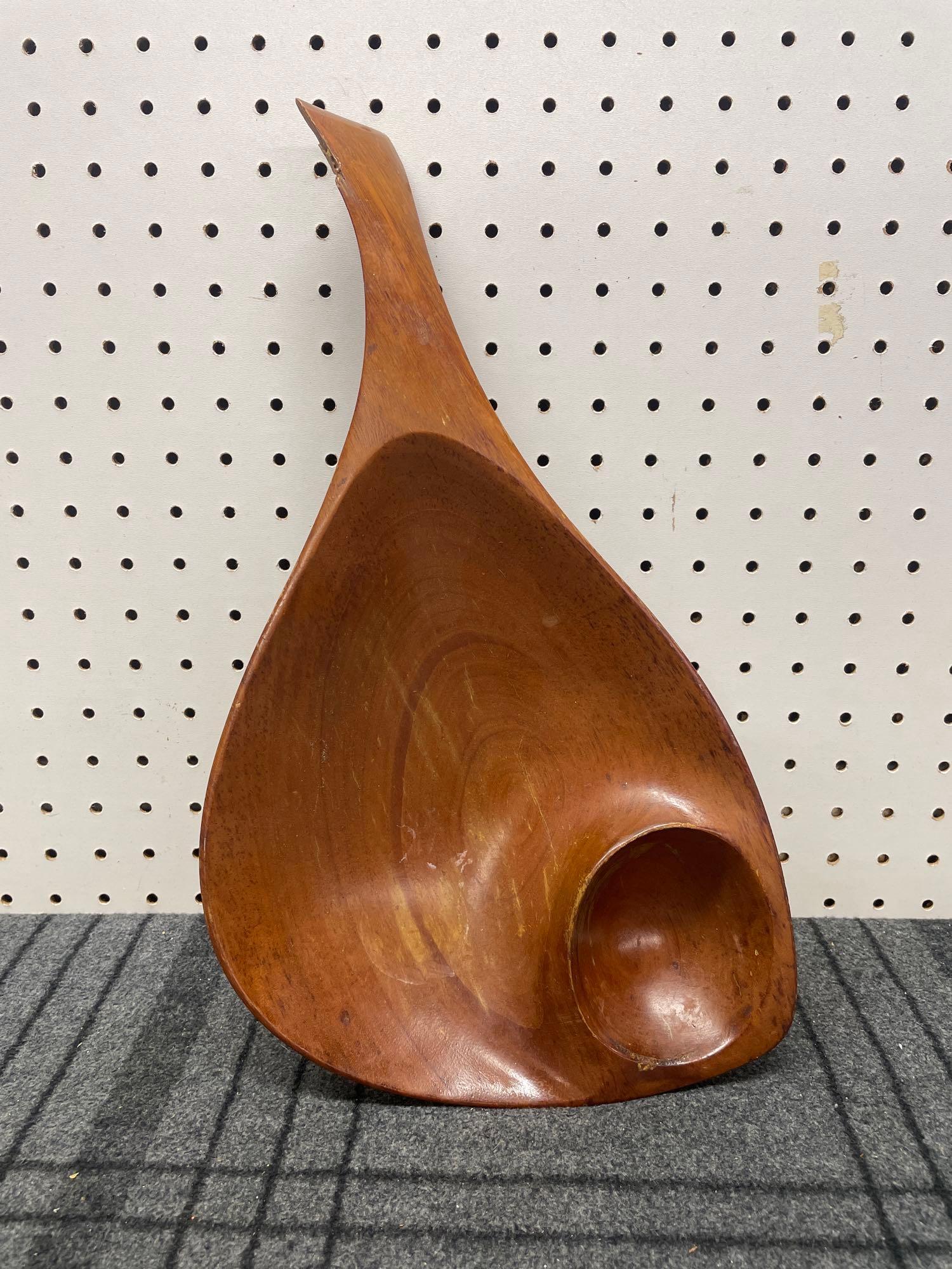 Emil Milan Wooden Serving Bowl: (B) A handmade mahogany serving bowl by Emil Milan. Signed Emilan on the bottom. One chip on the handle. Measures 17in long x 9in wide x 2-1/2in tall. Global shipping available on all items. For a shi