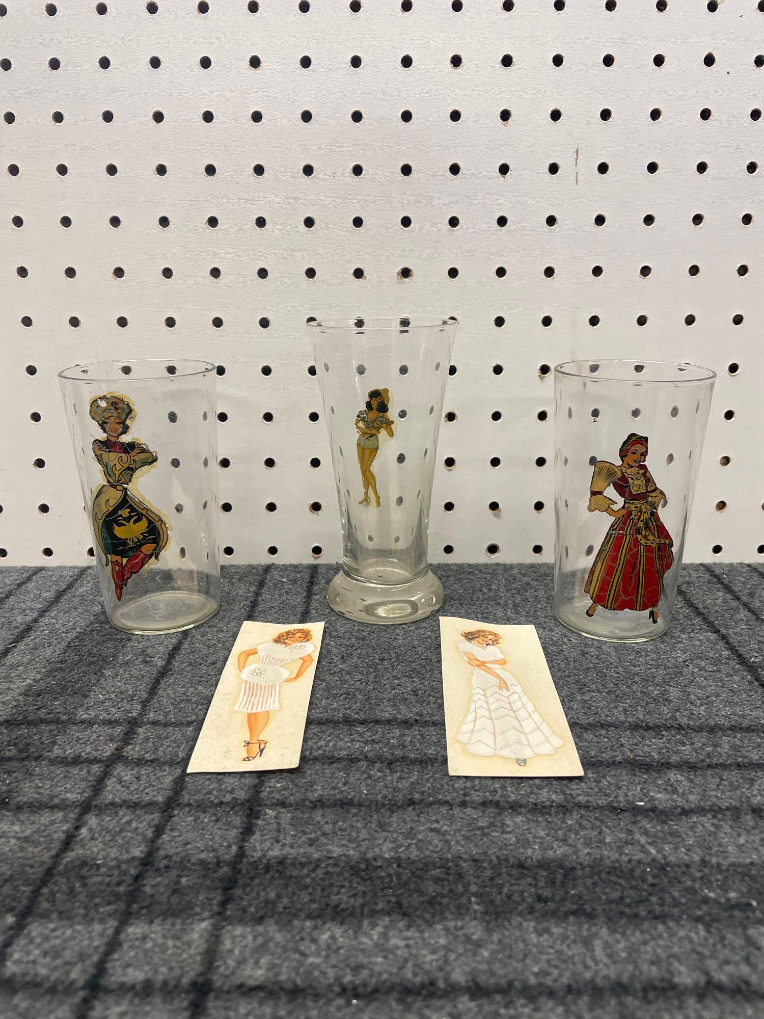 Art Deco Nude Glass Set with Decal Kit: (B) A set of three vintage glasses with women on the front who appear nude when viewed from within the cup. includes a pair of original decals to apply this effect to any piece of glassware. Tallest c