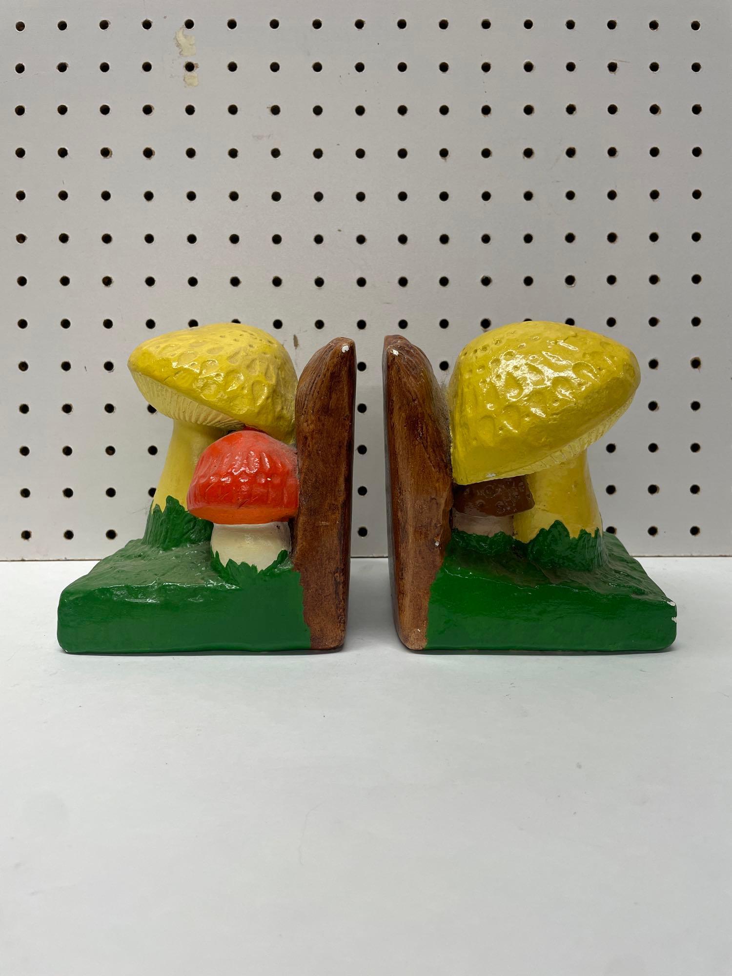 Vintage Mushroom Bookends: (B) A great pair of mushroom themed pottery bookends. Some minor chips here and there but they display well. Each bookend measures 4-3/4in long x 4-1/4in wide x 5-1/2in tall. Shipping available on all