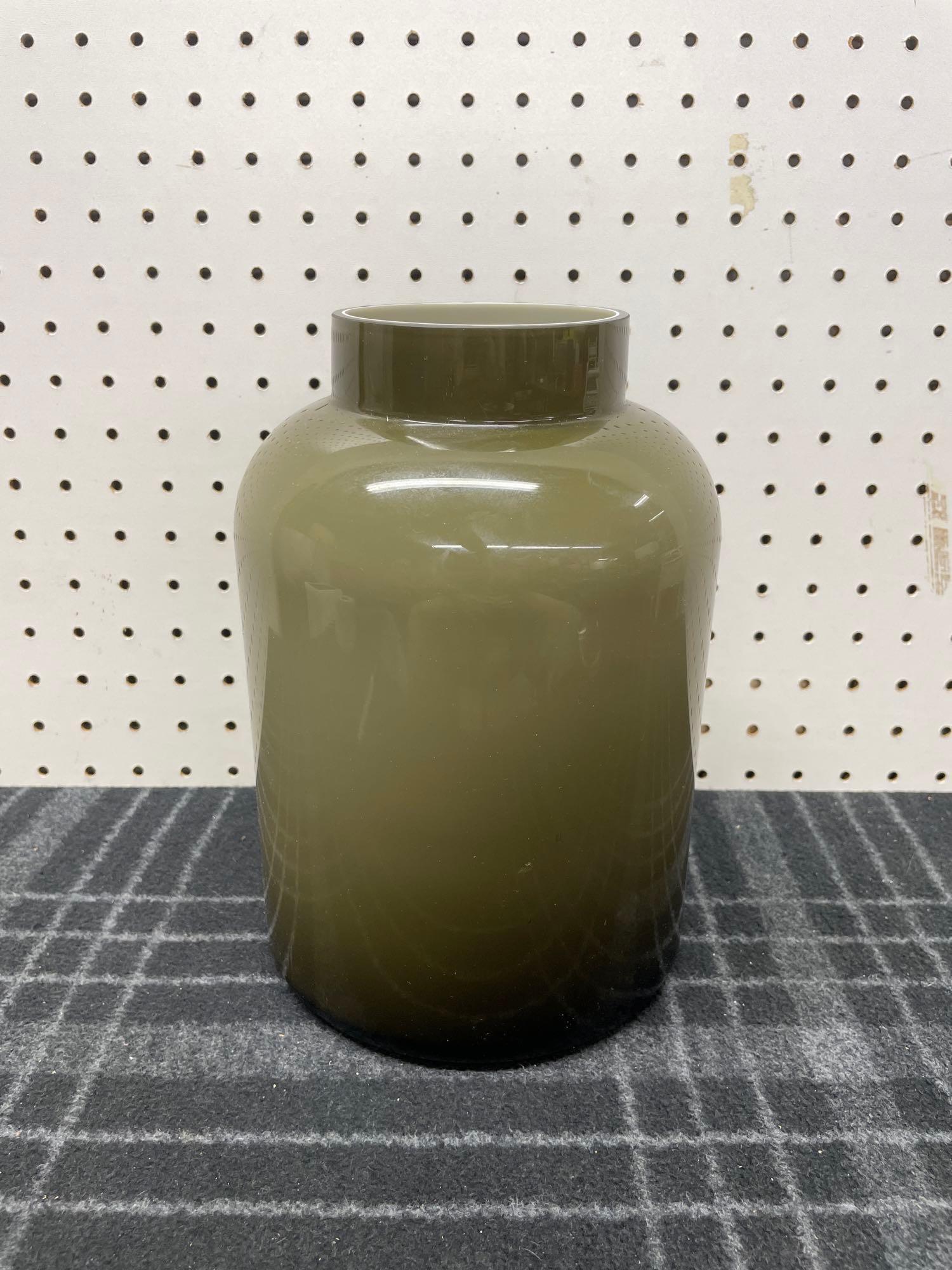 Vintage Grey Cased Glass Canister Vase: (P2) A vintage cased glass canister style vase with a smoke grey exterior and a white interior. No chips or cracks. Measures 10in tall x 7in diameter. Shipping available on all items. For a delivery q