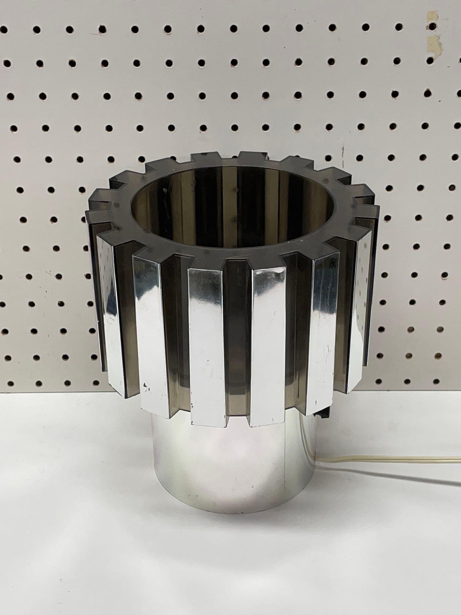 1973 Burman Space Age Gear Lamp: (S) A mid-century modern "Gear" lamp by Burman Co. Marked 1973 on the bottom. Measures 9in tall x 8in diameter. Shipping available on all items. For a delivery quote, call Mail Dock at (717) 274-6600.