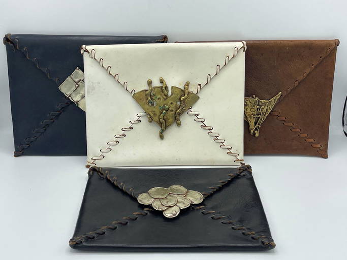 Four Spanish Leather Clutches (0070) on Dec 08, 2022 Briggs Auction
