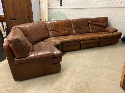 Roche Bobois Brown Leather Sectional Sofa: A Roche Bobois four-piece brown leather sectional sofa. 32in tall x approx. 10ft long.