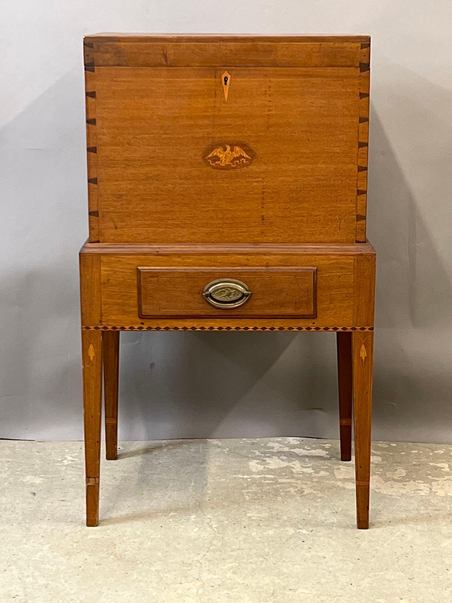 Federal-style Inlaid Cellerette on Stand: A Federal-style cellarette on stand with eagle inlaid panels. 36-1/4in tall x 21-1/2in wide x 16in deep.