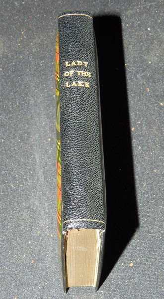 Sir Walter Scott: The Lady of the Lake. Published: 1870, Adam and Charles Black, Edinburgh. Leather bound with celluloid front and back covers in Scotch plaid. Front cover features image of Loch Katrine.