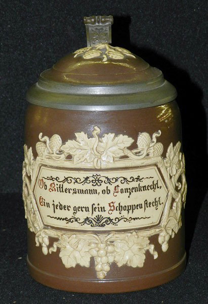 Mettlach: Villeroy and Boch Tankard: #1180; 1/2L; Grape and Grape leaf pattern in relief; 5 1/2" high, 5" wide, 3 1/4" diam.