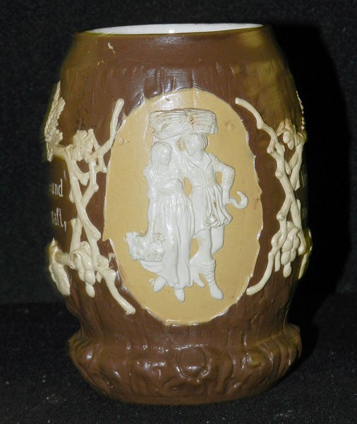 Mettlach: Villeroy and Boch Stein: #1028; Couple returning from harvest in relief; 5 1/4" high, 5" wide, 3 1/4" diam