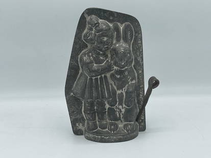 Anton Reich Chocolate Mold: An Anton Reich Beatrix Potter tin chocolate mold depicting a young girl talking to Peter Rabbit. Marked 24221, and 46 on front. Marked Anton Reich. 8 in tall x 5 in wide.