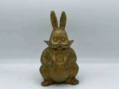 Harrison Cady Cast Iron Figure: A Harrison Cady Peter Rabbit cast iron full figure with gilt painted detail. 9-1/2 in tall x 4-1/2 in wide.