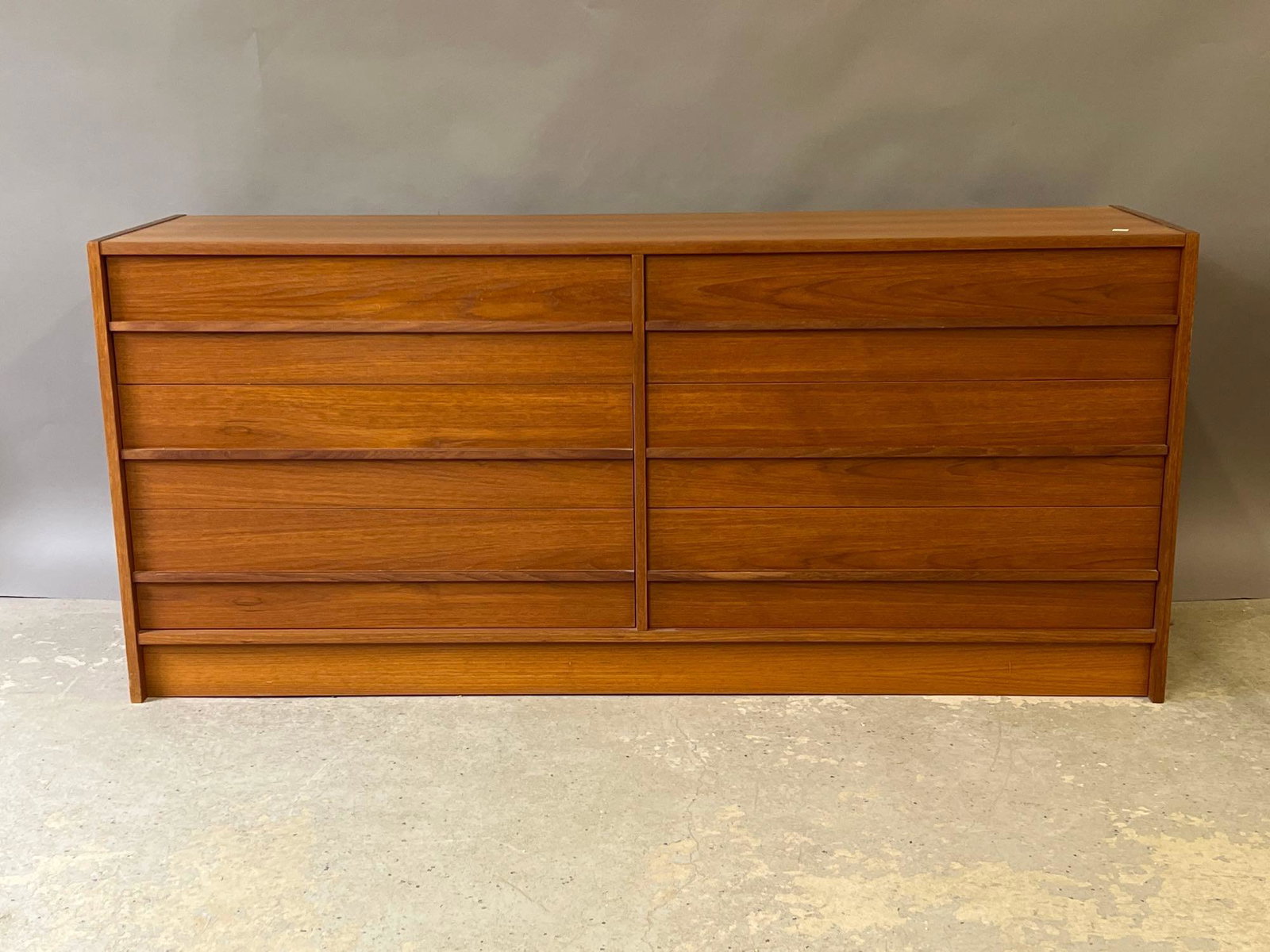 Danish Modern Teak Dresser: A Danish modern six-drawer teak dresser. 26-1/2in tall x 59in wide x 16in deep. | Local and NYC curbside delivery details and international third-party shipper recommendations are available on BriggsA