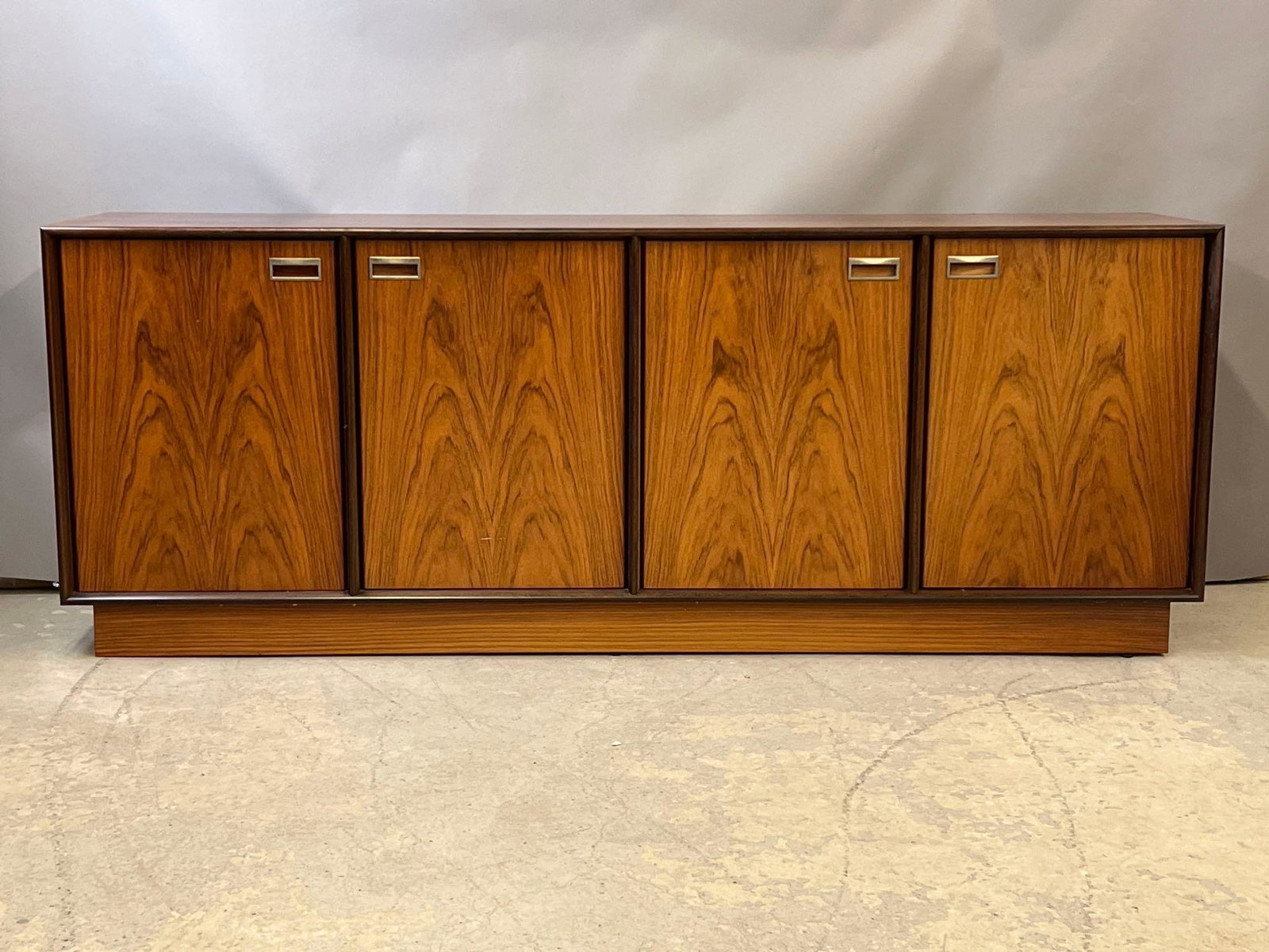 Danish Modern Rosewood Credenza: A Danish midcentury modern four-door rosewood sideboard/credenza. Unmarked. 30in tall x 78in wide x 19in deep. | Local and NYC curbside delivery details and international third-party shipper recommend