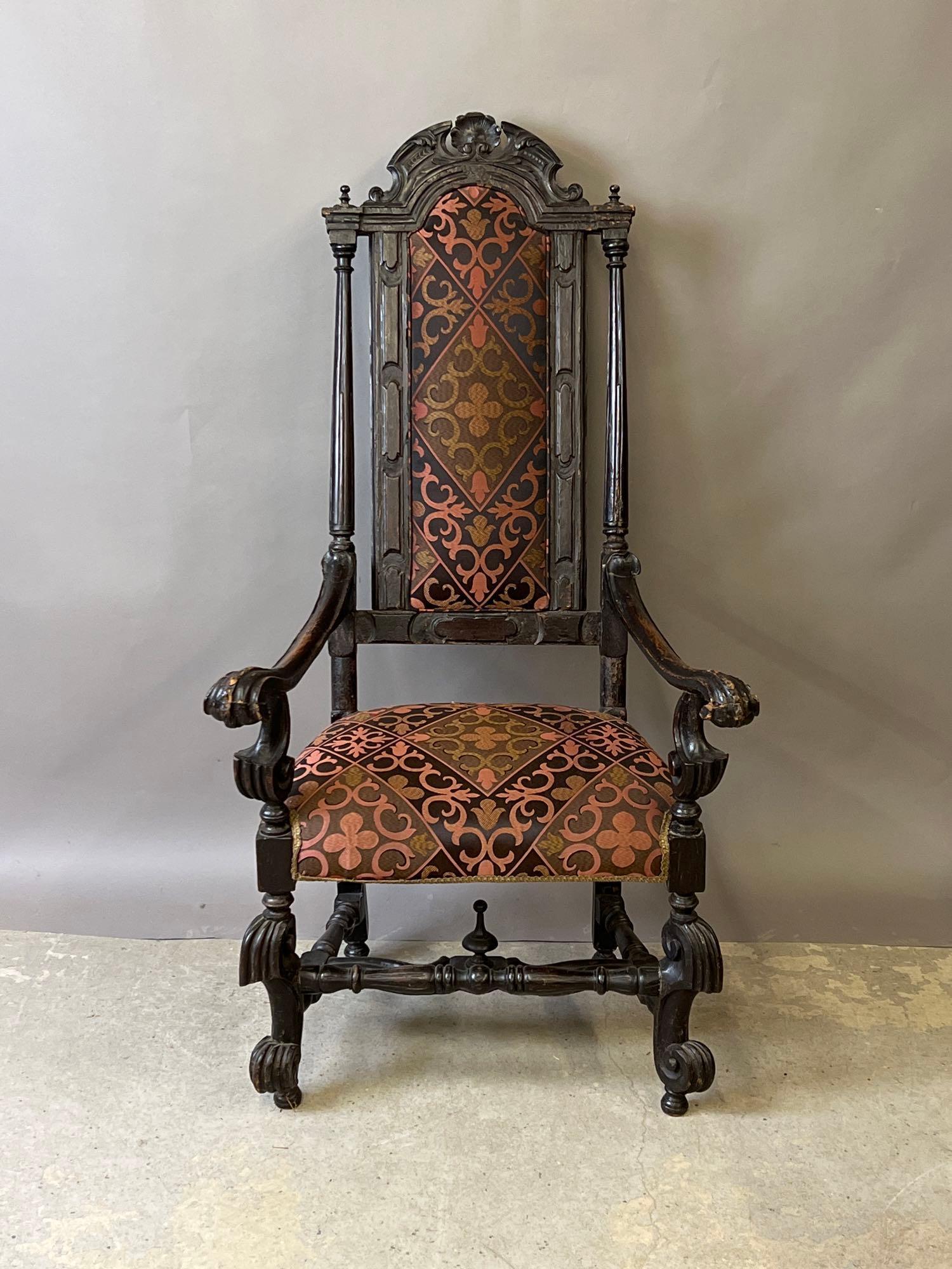 Baroque Carved Mahogany Hall Chair: A 19th C. or earlier baroque carved mahogany hall chair with scrolled arms and stretcher base. Contemporary upholstery. 53in tall x 28in wide x 27in deep. | Local and NYC curbside delivery details and