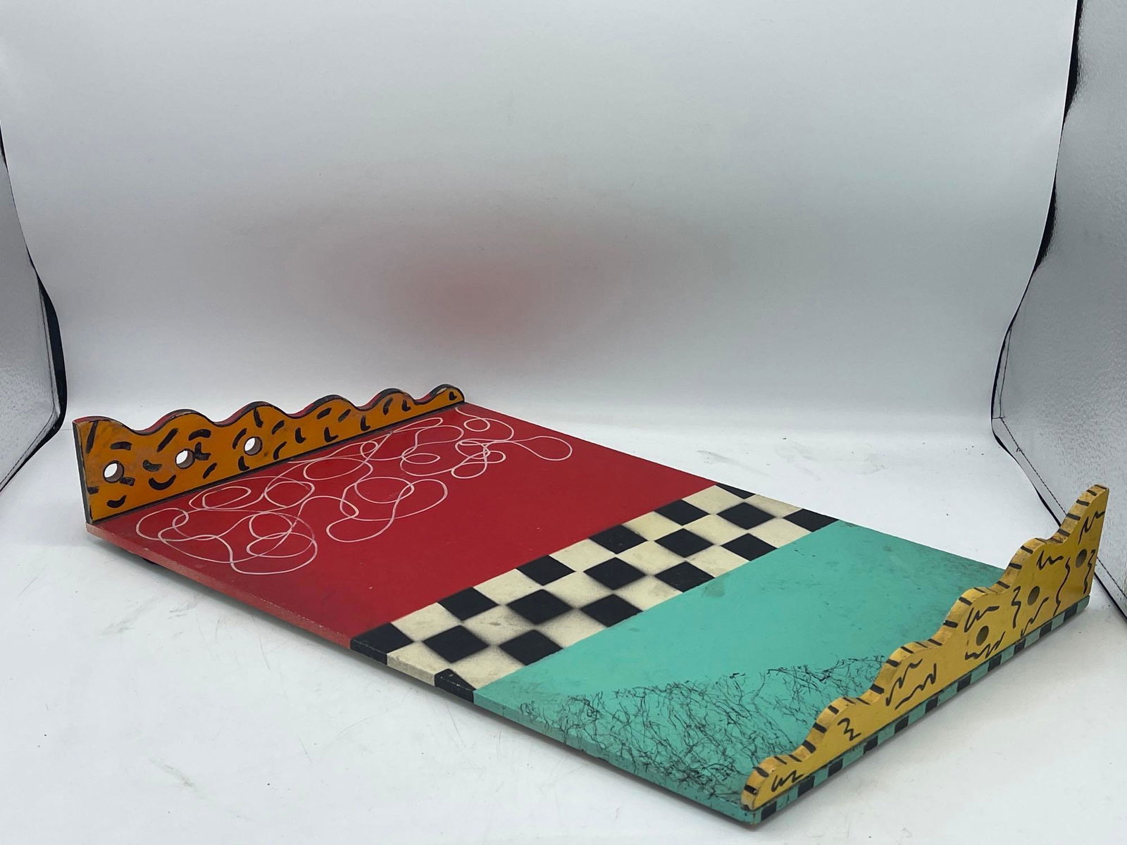 Hollis Fingold Signed Postmodern Tray: A Hollis Fingold signed Memphis postmodern wood tray with hand-painted detail and scalloped edges. Signed "Hollis Fingold" on back, numbered 22/250. 3-1/2in tall x 16-1/2in wide. | Local and NYC curbs