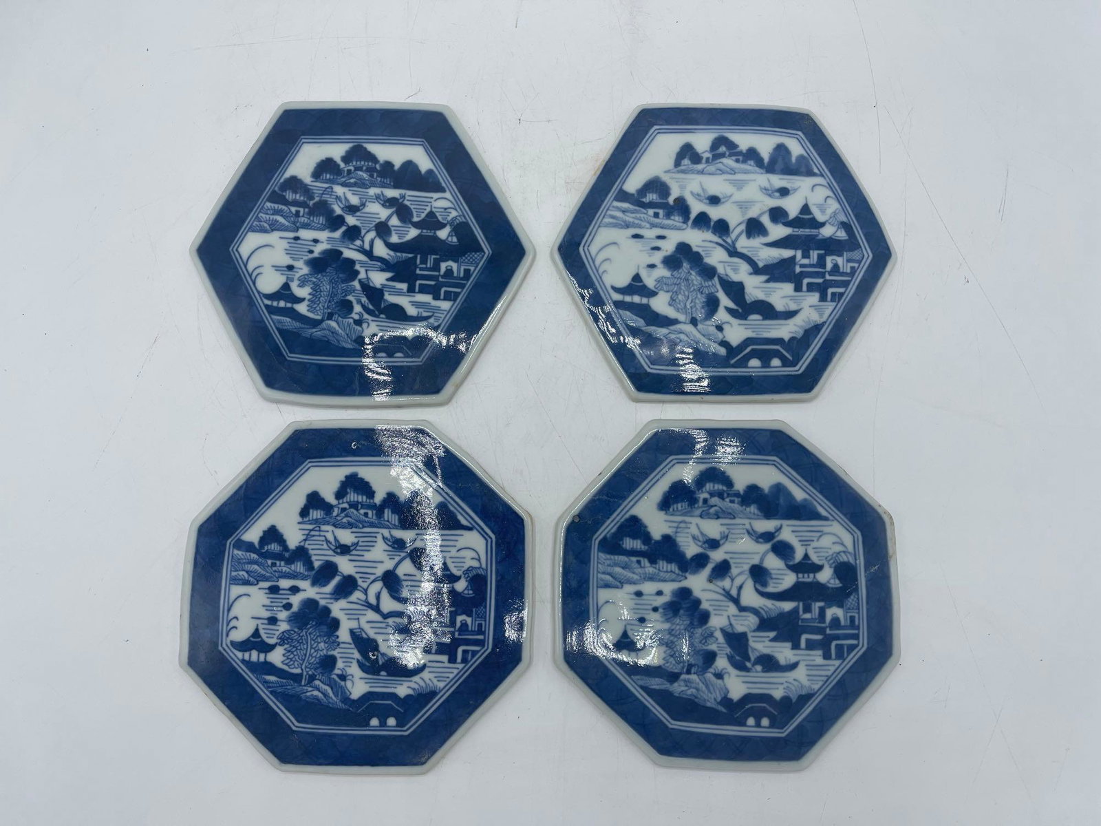 Four Chinese Canton Blue & White Tiles: Four Chinese Canton blue and white tiles. 5in diameter. | Local and NYC curbside delivery details and international third-party shipper recommendations are available on BriggsAuction.com.