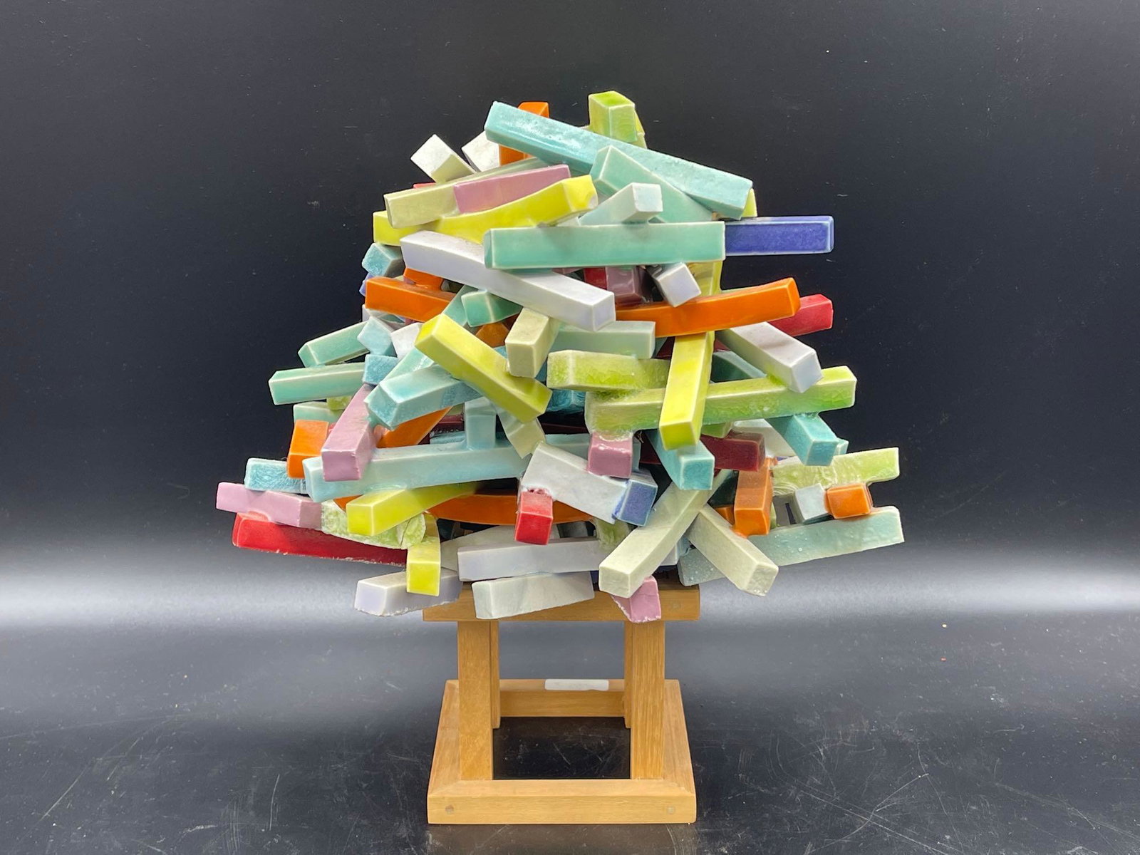 Abstract Clay Sculpture: An abstract clay sculpture comprised of multiple pieces of colorfully-glazed clay, resting on wood base. Unsigned. 7-1/2in tall x 8in wide. Provenance: Chestnut Hill Arts & Crafts private collection. 