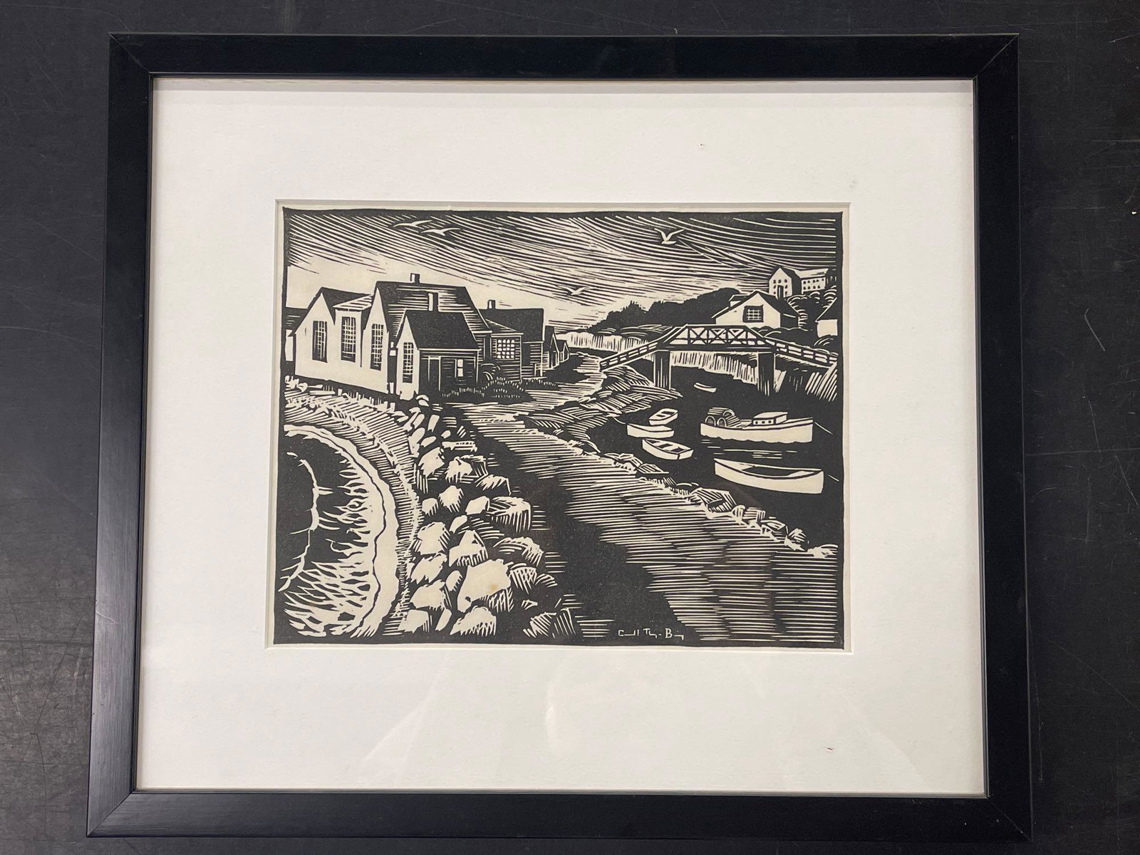 Carol Thayer Berry. Woodcut, Shore Town Scene: Carol Thayer Berry (American, 1886-1978). A woodcut print depicting a shore town, signed in print. Mat opening: 7-1/2in. x 10in Frame: 13-1/2in x 15-1/2in. | Local and NYC curbside delivery details an