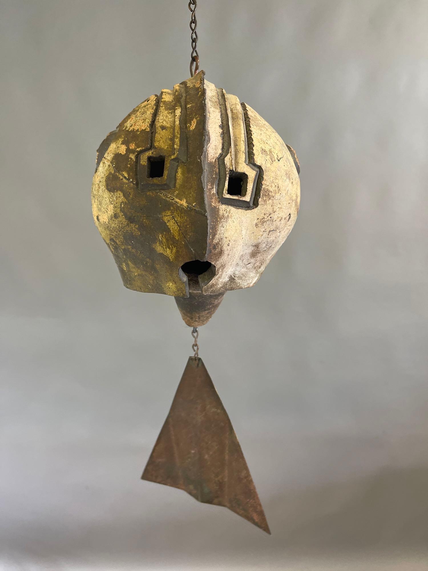 Clay Chime: Paolo Soleri for Arcosanti: A Paolo Soleri for Arcosanti clay chime bell, marked on side. 14in long. | Local and NYC curbside delivery details and international third-party shipper recommendations are available on BriggsAuction.