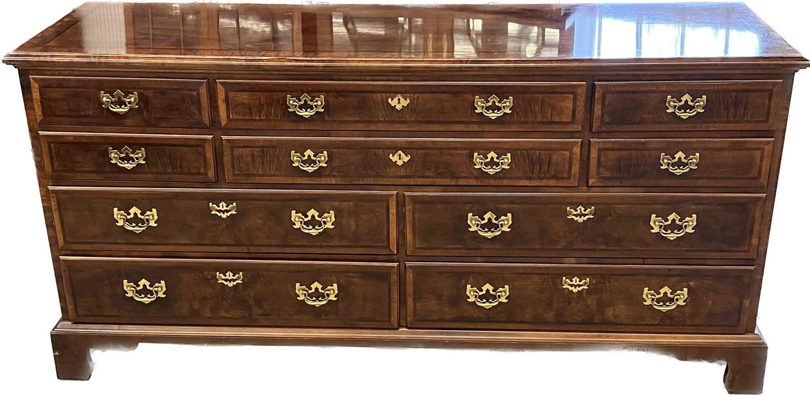 Henredon Aston Court Dresser: A Henredon Aston Court Chippendale-style banded mahogany dresser. 34in tall x 70in wide x 20in deep. | Local and NYC curbside delivery details and international third-party shipper recommendations are