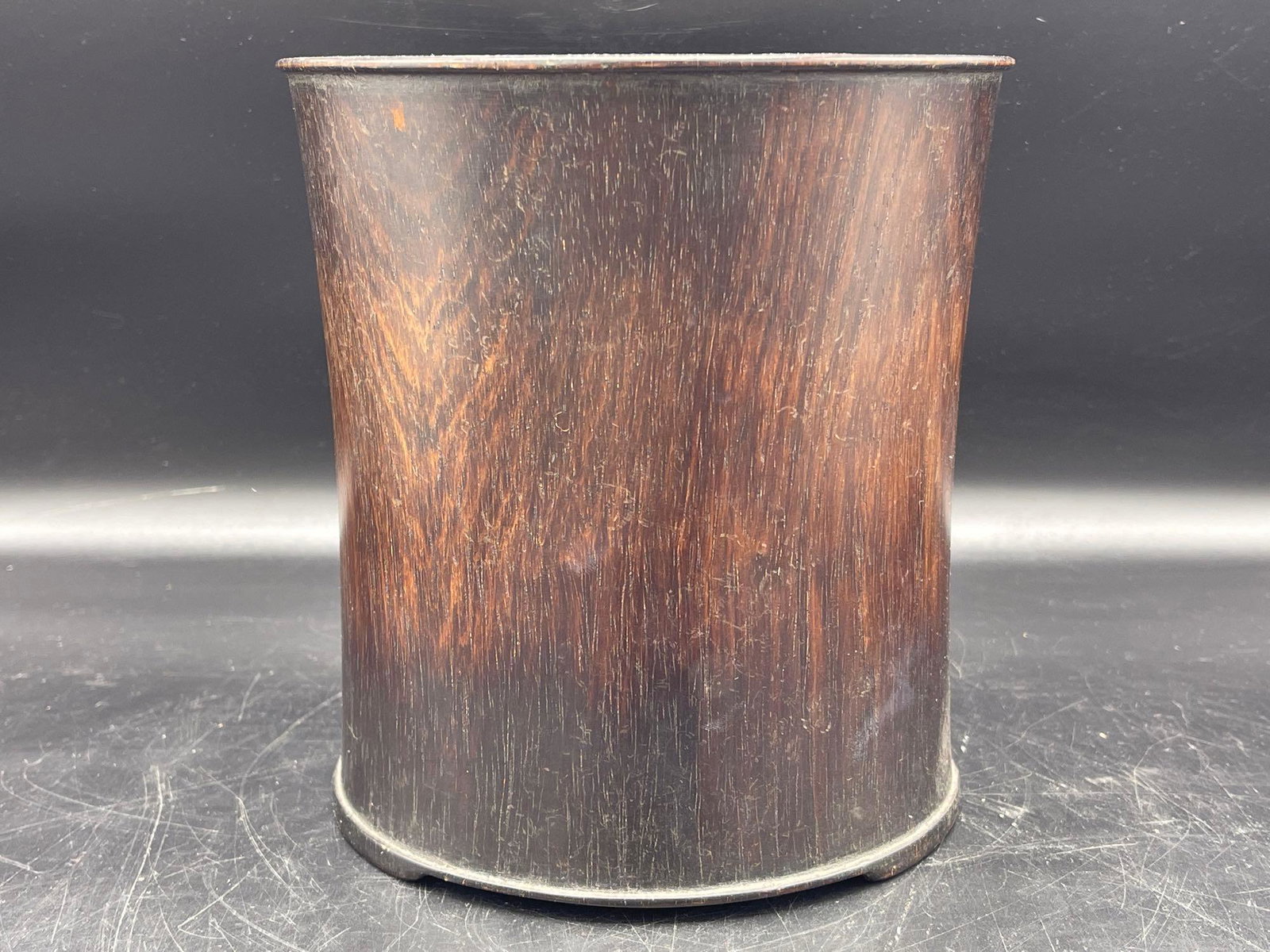 Chinese Hardwood Brush Pot: A Chinese hardwood brush pot of slightly curved cylindrical shape, raised on three low feet. 7in tall x 6-1/2 in wide. | Local and NYC curbside delivery details and international third-party shipper r