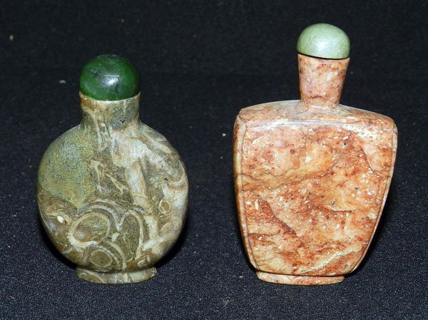 Two Chinese Stone Snuff Bottles: Two Chinese stone snuff bottles. Hardstone: 2-3/4" tall. Soapstone: 3" tall.