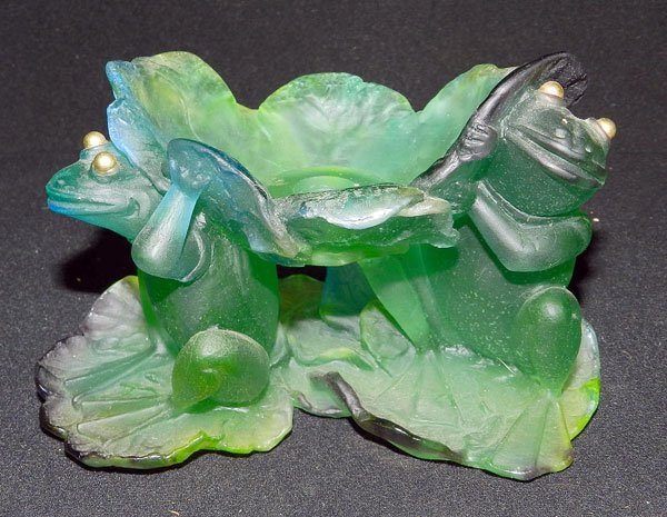 Daum Art Glass Candlestick: Daum green glass candlestick supported by two frogs on lily pads. 4-1/2" tall; 7" wide.