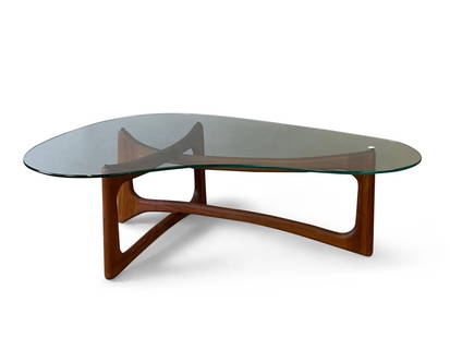 Adrian Pearsall Cocktail Table: An Adrian Pearsall American Modern cocktail table with a kidney-shaped glass top over a sculpted walnut base. Unmarked. 15-3/4in tall x 50-1/2in wide x 30in deep. | Philadelphia Metro area and NYC cur