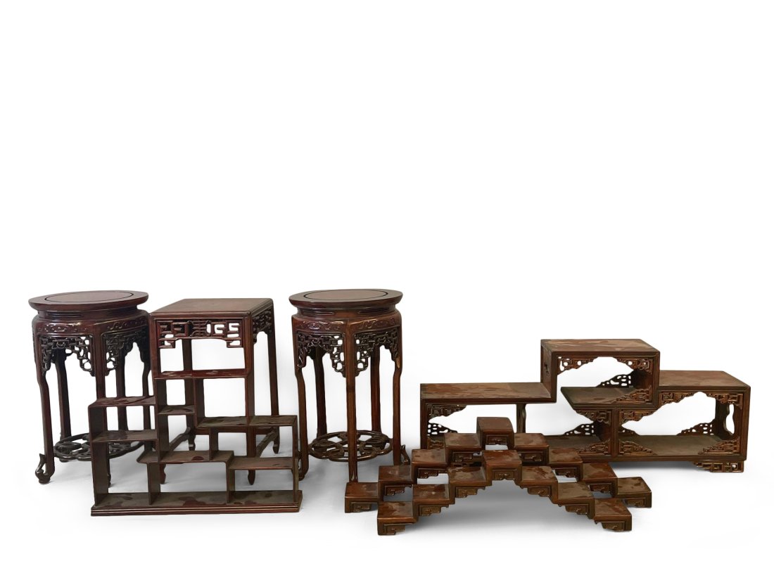 Seven Chinese Hardwood Stands: A grouping of seven carved Chinese hardwood stands. Largest: 12-1/2in tall x 8in wide. | Philadelphia Metro area and NYC curbside delivery details, and international third-party shipper recommendation