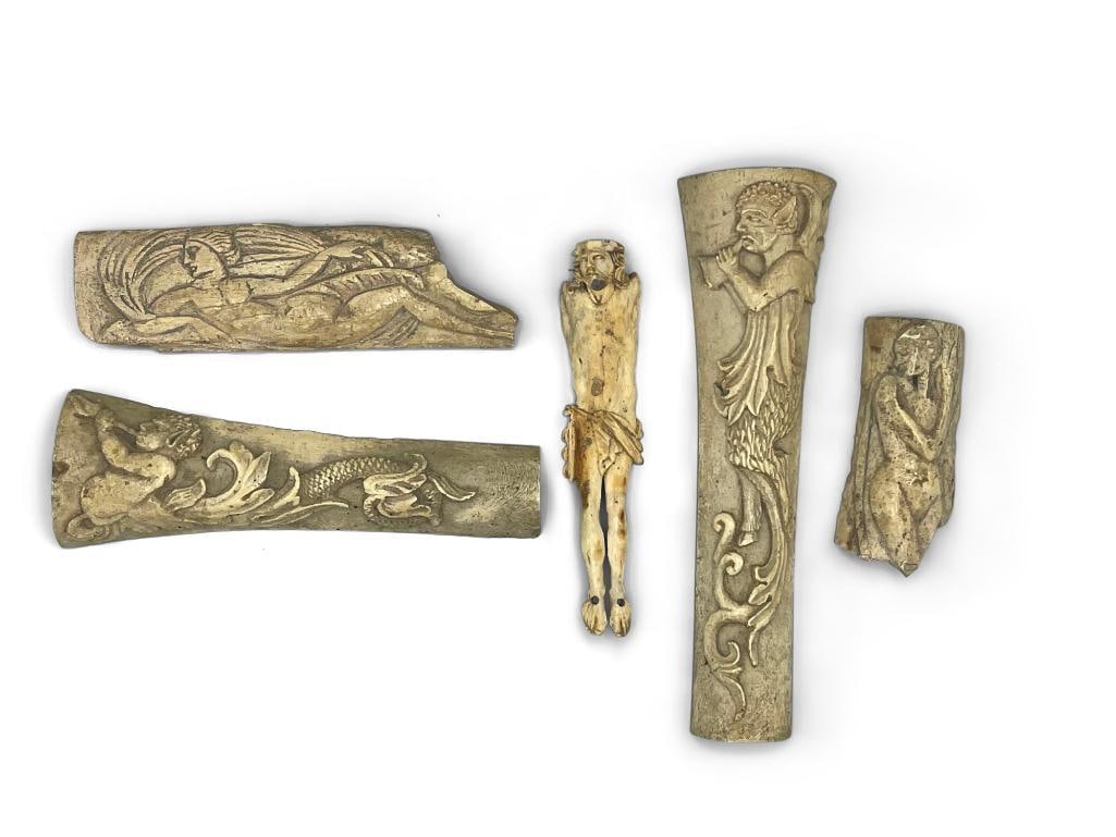 Five Carved Early Roman/Byzantine Plaques: Five carved early Roman/Byzantine plaques to include a reclined nude figure of Pan playing the lute, a crucified Jesus lacking arms, a nude woman, and a Palaimon plaque. Largest: 8-1/2in tall x 2in wi