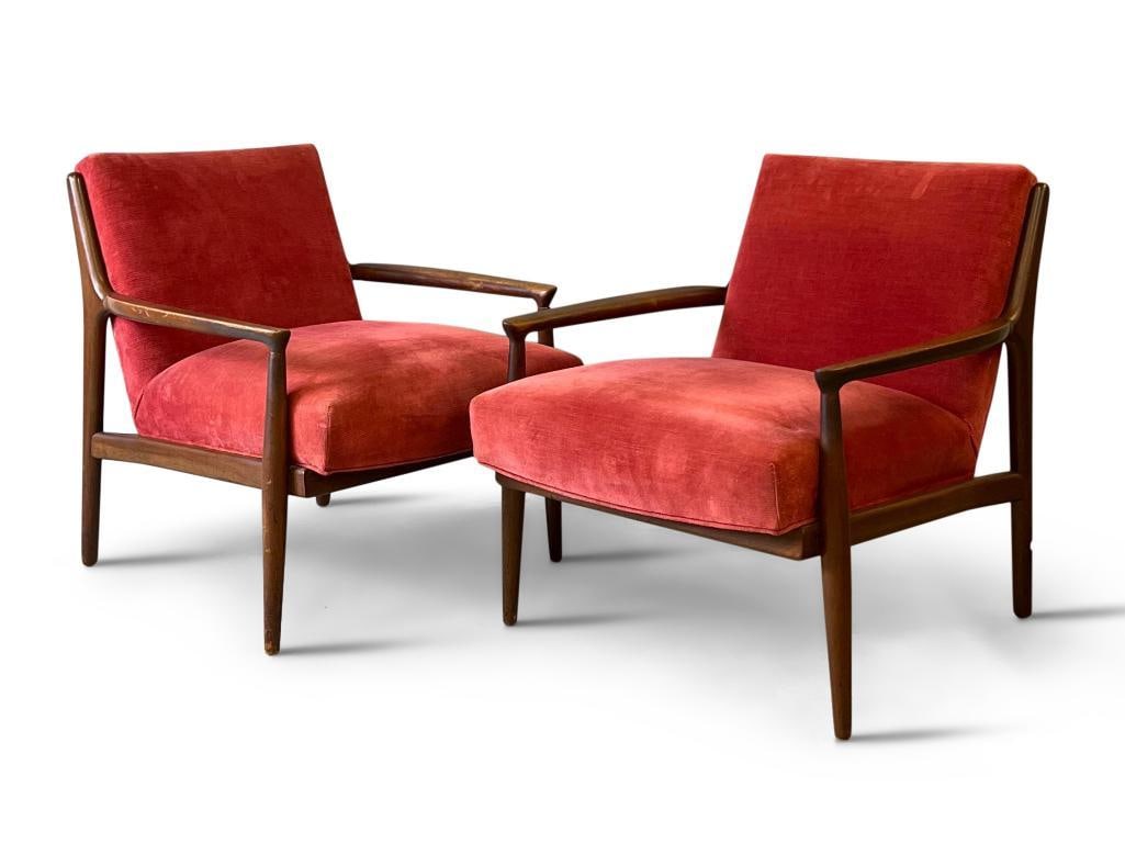 Pair of Midcentury Modern Lounge Chairs: A pair of midcentury modern armchairs with red upholstery. Unmarked. 30in tall x 27in wide x 28in deep. | Philadelphia Metro area delivery, NYC curbside delivery, and international third-party shipper
