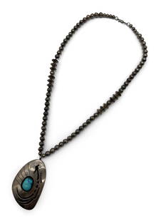 John White Navajo Silver Necklace: A John White Navajo silver bead necklace with roadrunner-design pendant with turquoise cabochon. Signed on back. Chain: approx. 26in long. | Philadelphia Metro area delivery, NYC curbside delivery, an