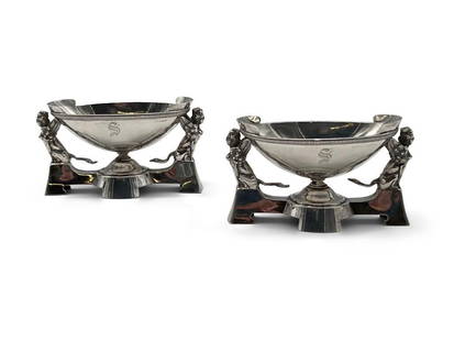 Pair of Gorham Egyptian Revival Salt Cellars: A pair of Gorham Egyptian-Revival salt dishes with winged Sphinx supports and "S" monograms. Gorham markings on bases and are also marked 645. Bases appear to be silver plate with the bowls possibly s