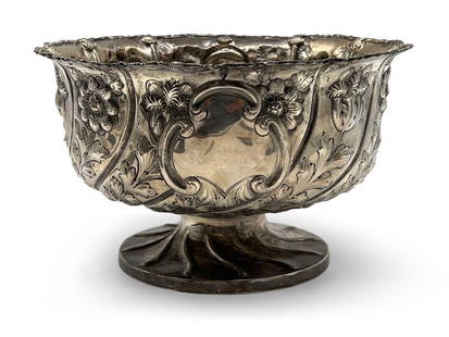 English Edwardian Sterling Center Bowl: An English Edwardian sterling silver center bowl with repoussé foliate design. Hallmarked for George Nathan and Ridley Hayes, Birmingham. 5-3/4in tall x 9-1/2in diameter. Approx. 22.89 ozt. | Phila