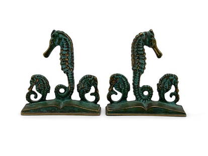 After E.T. Hurley Bronze Seahorse Bookends: A pair of Arts & Crafts-style bronze seahorse bookends with verdigris patina, after E.T. Hurley. Marked on underside for Virginia Metalcrafters. 5-3/4in tall x 5-1/2in wide. | Philadelphia Metro area