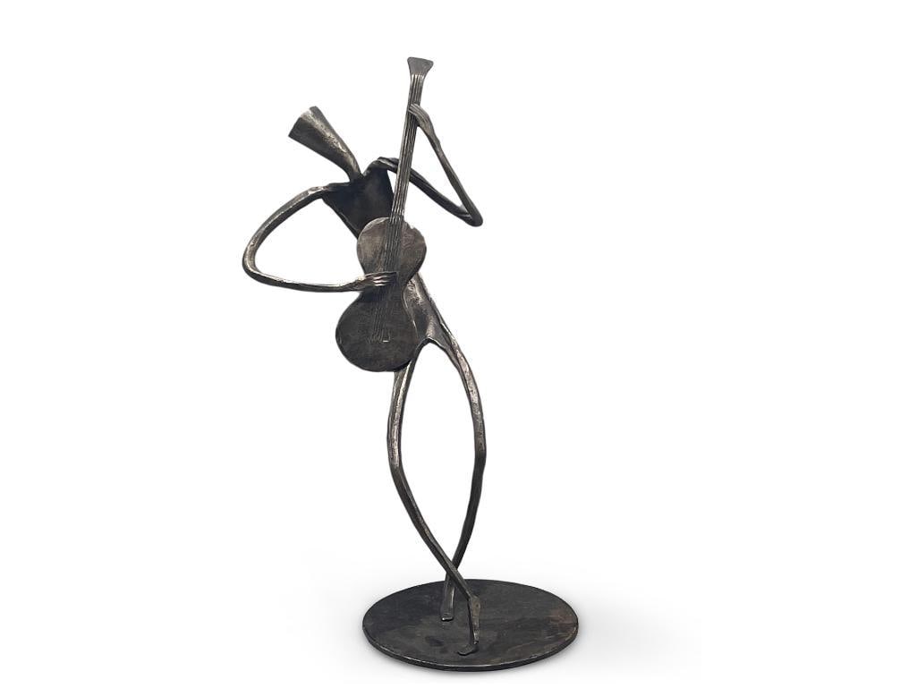 Laurids Lonborg. Iron, Abstract Figure: A Laurids Lonborg iron sculpture of an abstract figure playing the guitar. Marking on bottom. 12in tall x 5-1/2in wide. | Philadelphia Metro area delivery, NYC curbside delivery, and international thi