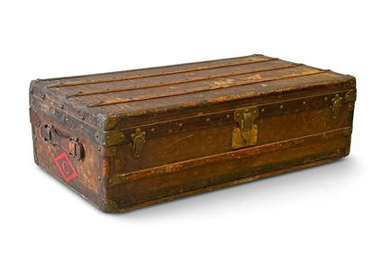 Louis Vuitton Monogram Steamer Trunk: An early 20th C. Louis Vuitton monogram steamer trunk, serial 046315, with original liner and key. 12in tall x 39-1/2in wide x 21-1/2in deep. | Philadelphia Metro area delivery, NYC curbside delivery,