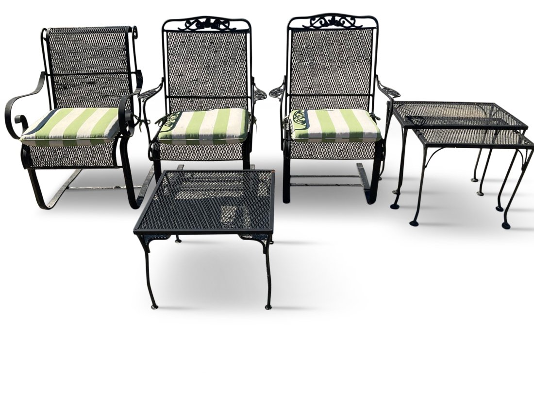 Trio of Woodard Patio Chairs and Side Tables: A trio of Woodard patio chairs and side tables. The chairs are cantilevered and wrought iron with two being alike. The three tables are wrought iron all being different t sizes. Chairs measure 37in ta